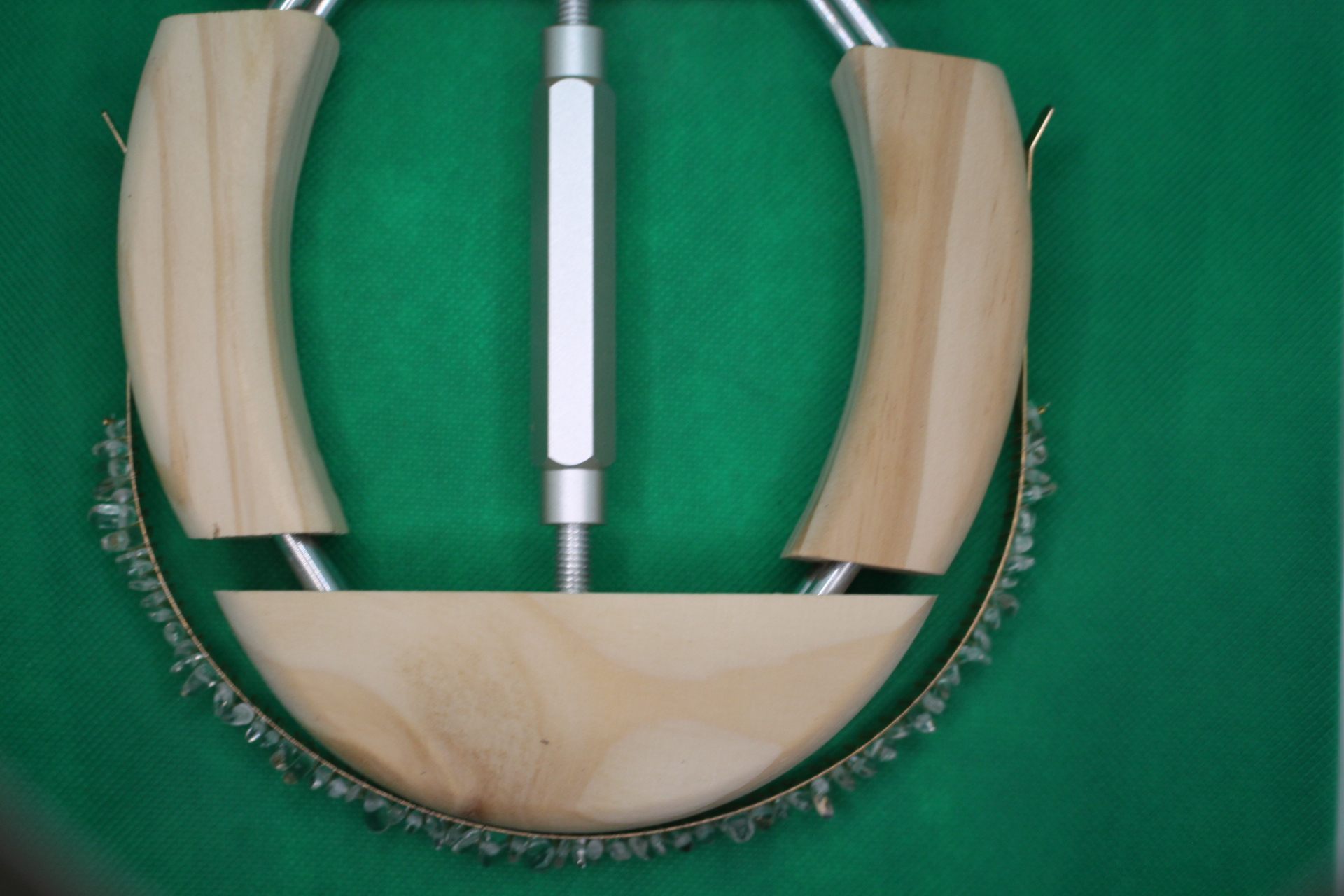 clear quartz headband being stretched by hat stretcher