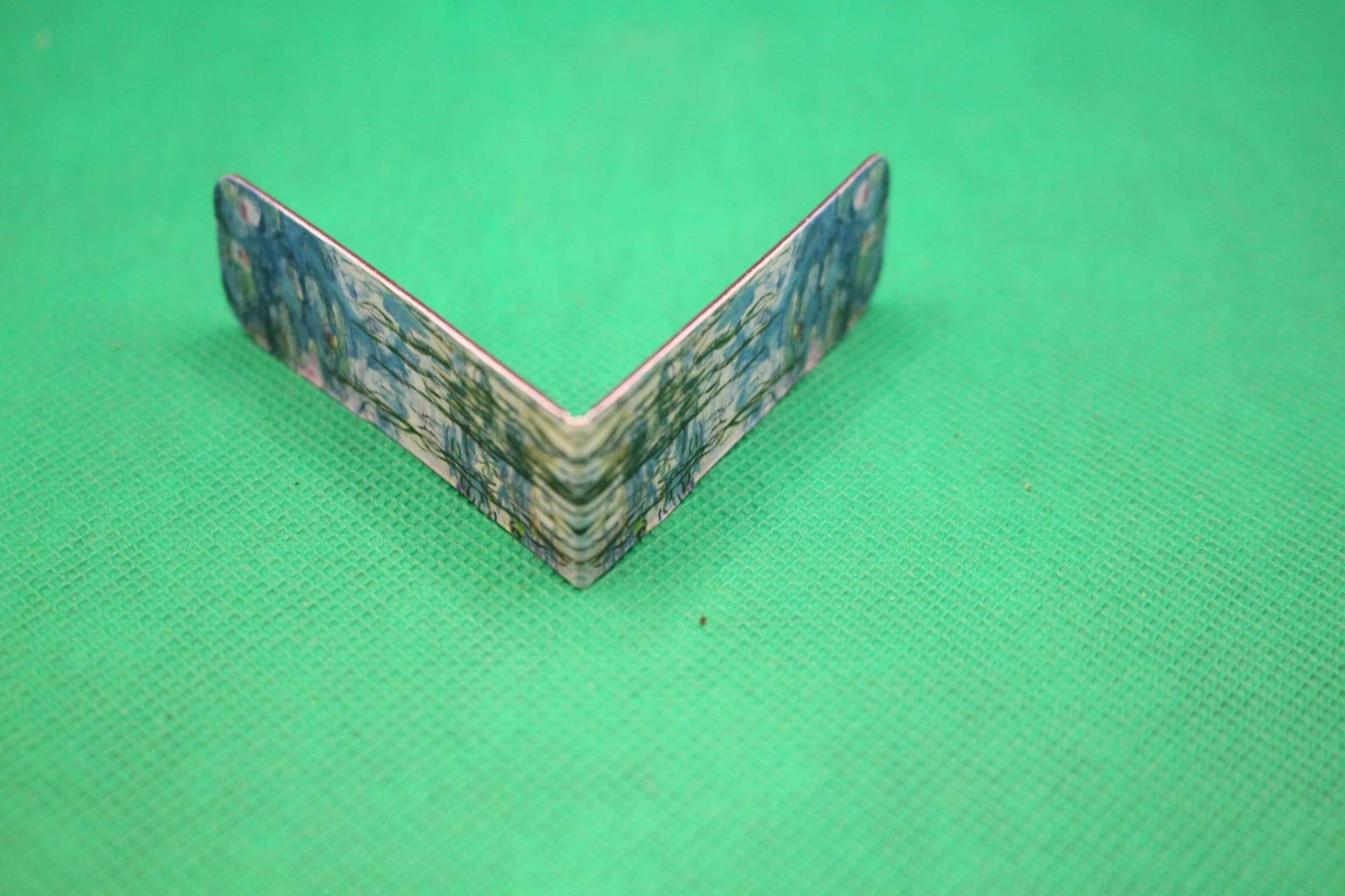 magnetic bookmark, folded to show image on both ends