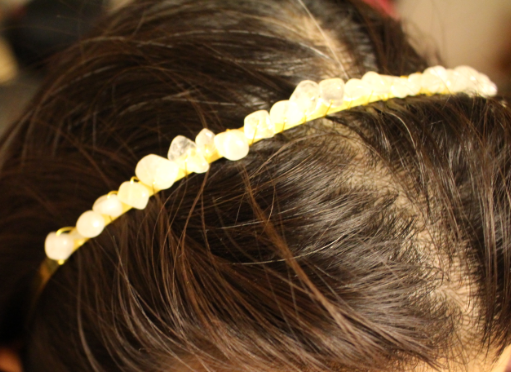 clear quartz crystal headband on top of head
