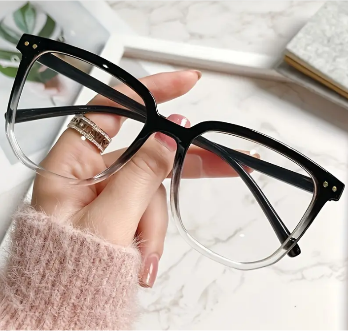two colored black  and clear blue light glasses from promo ad from Temu