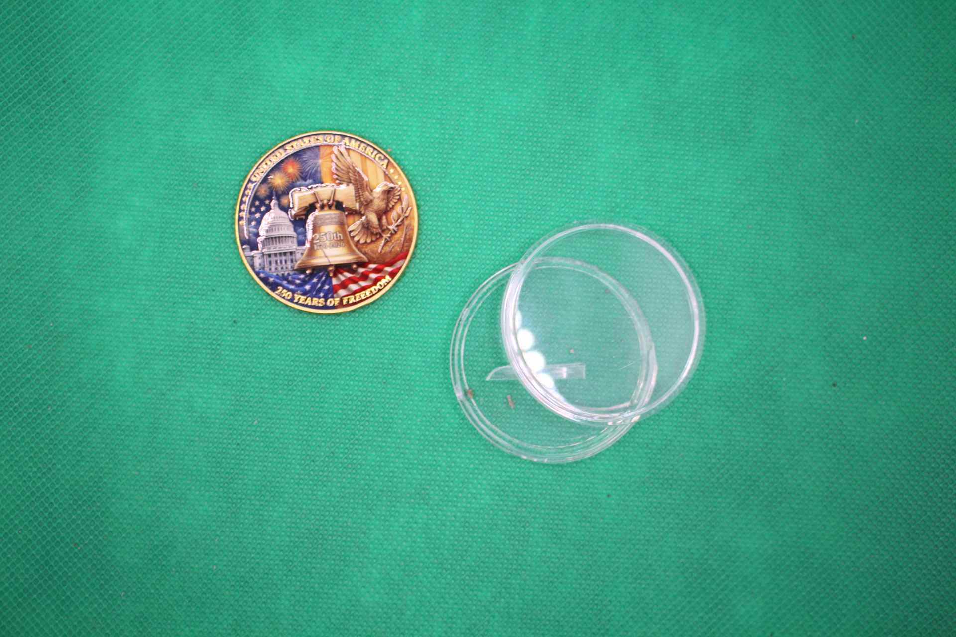 USA 250th anniversary commemorative coin design with plastic casing to the side