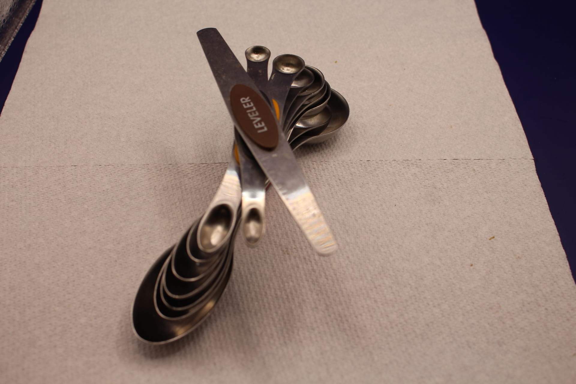 stainless steel measuring spoons set, demonstrating magnetic design 