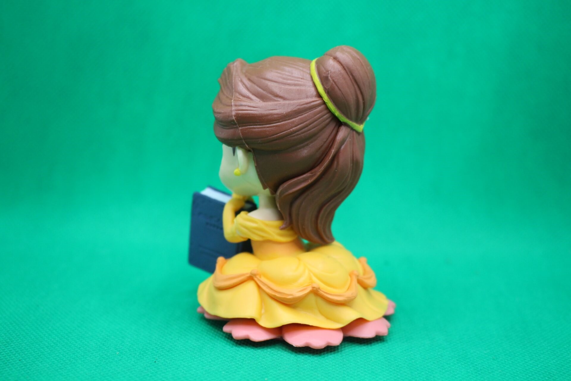 Belle figurine back side view