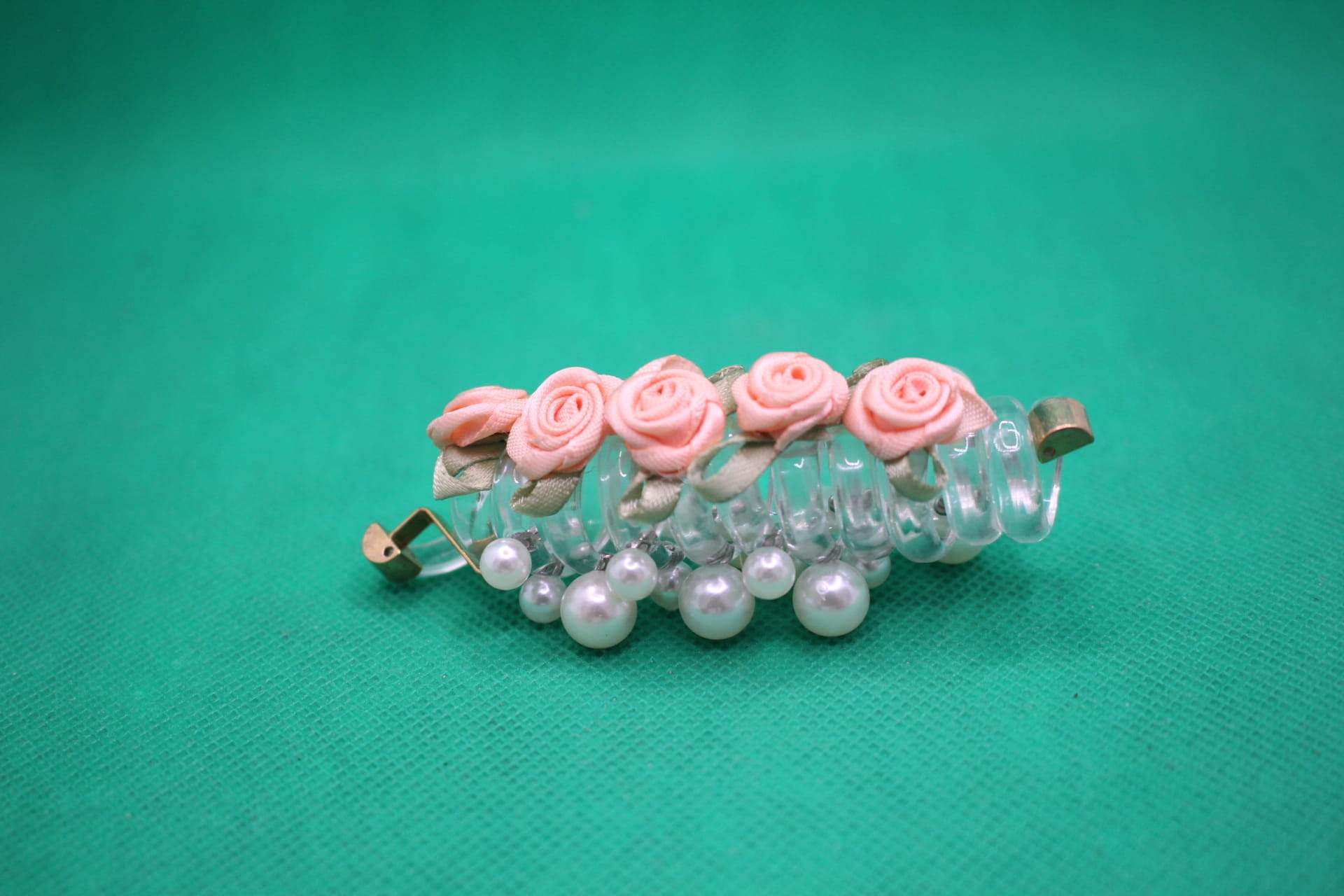 rose telephone cord hair tie side view -- peach color