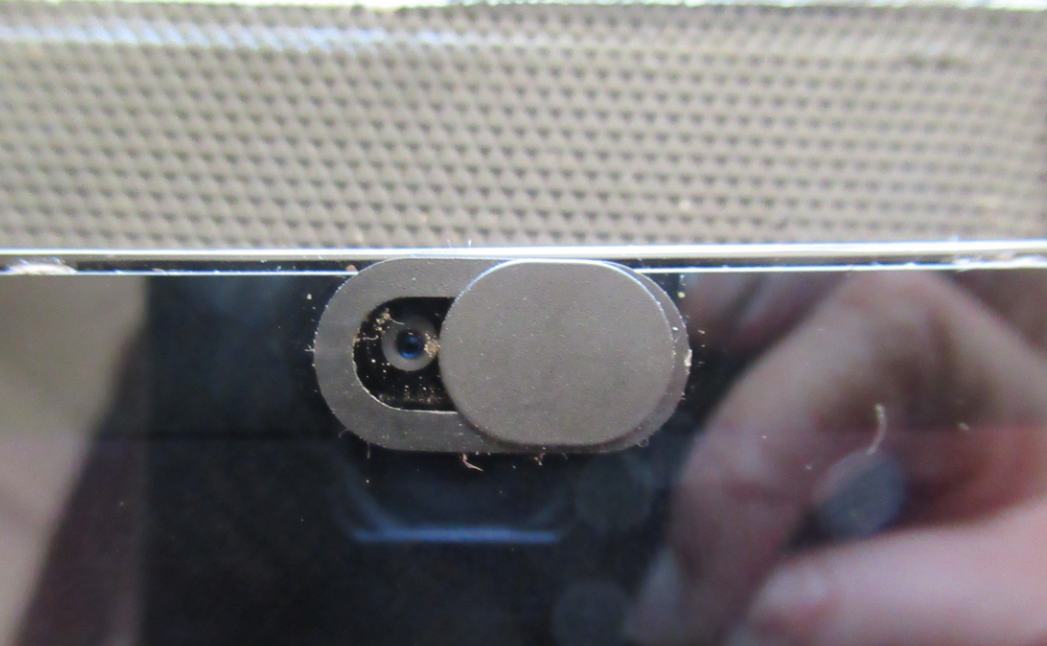 camera cover on laptop, with sticky residue left on laptop from stickers I used as covers in the past