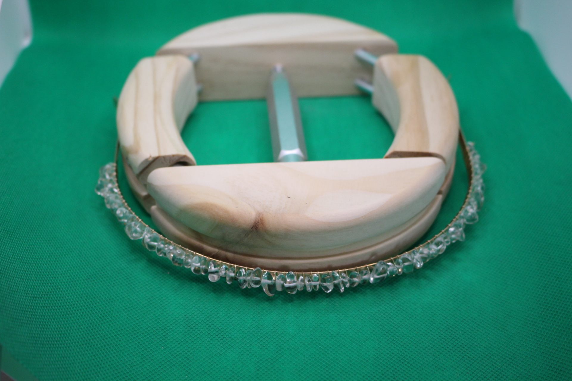 clear quartz headband being stretched by hat stretcher