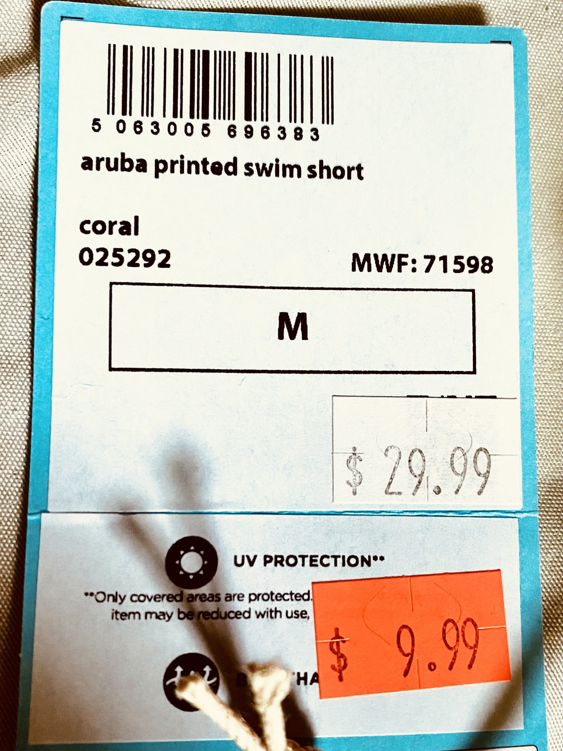 tag on Mountain Warehouse board shorts showing price and more