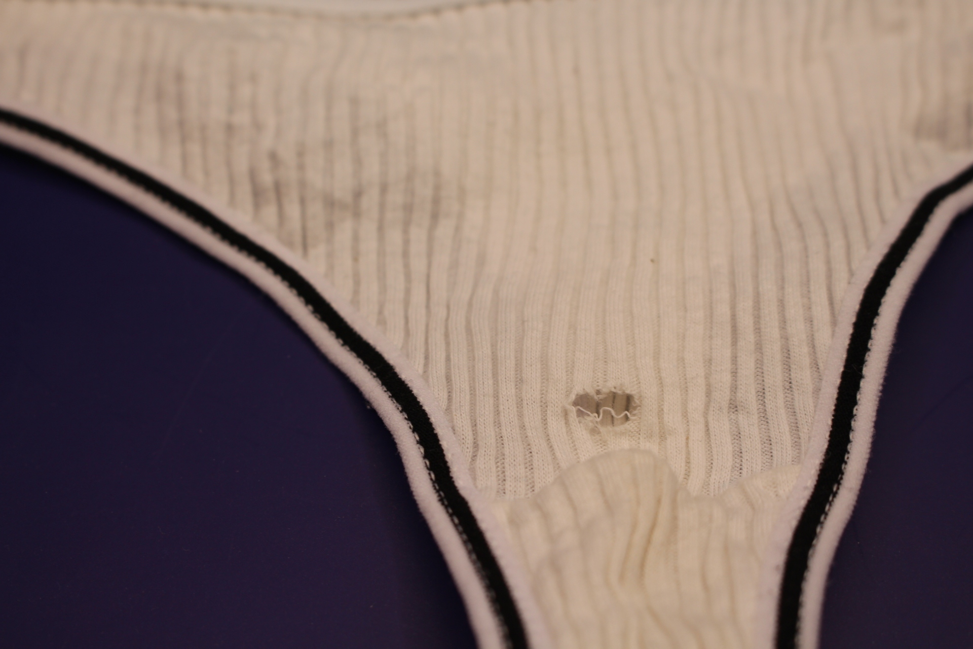 close-up of hole in cream-colored cotton LOVE YOU panties for women from Temu
