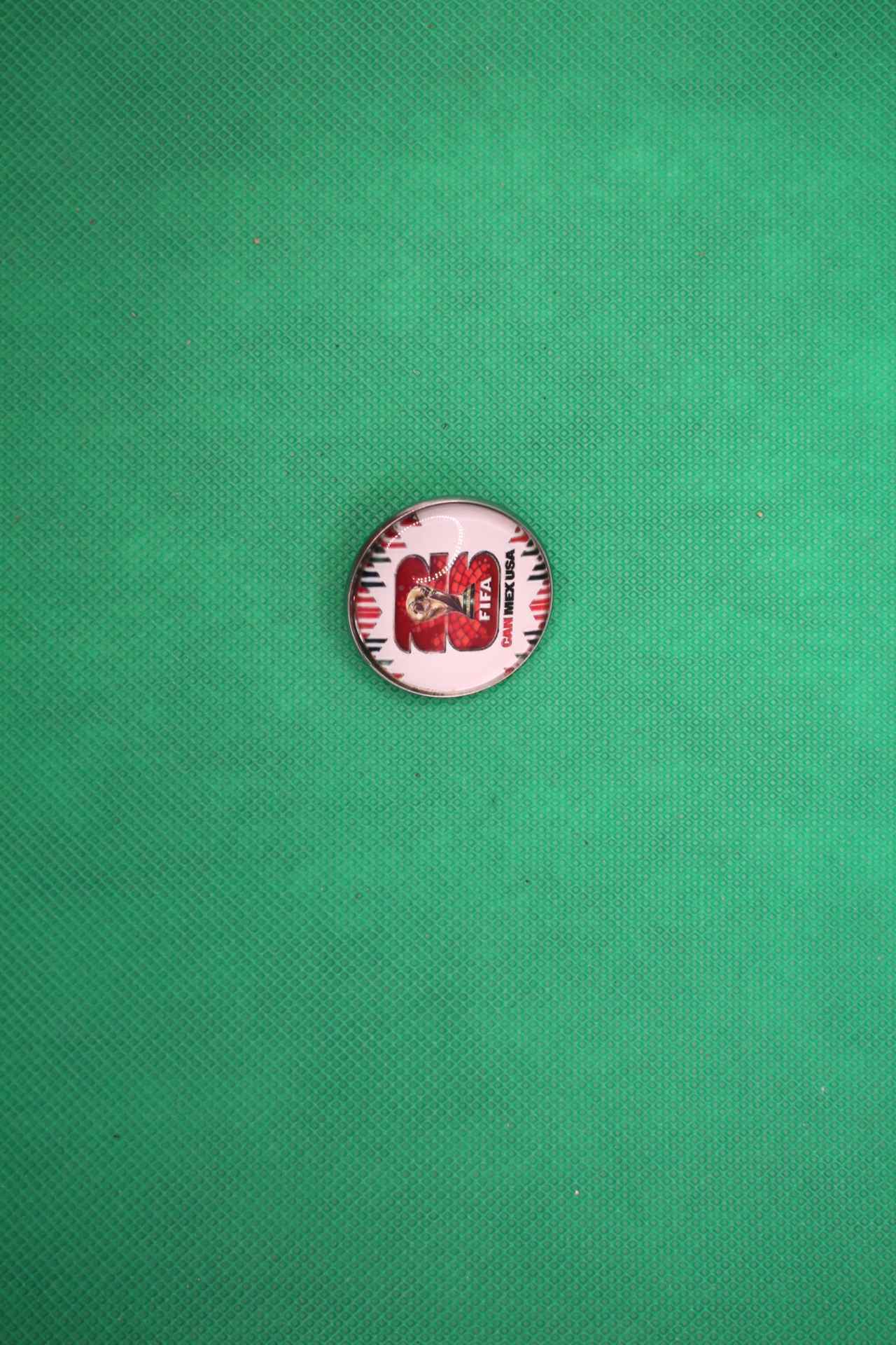 FIFA World Cup 2026 brooch pin with official logo image, side view