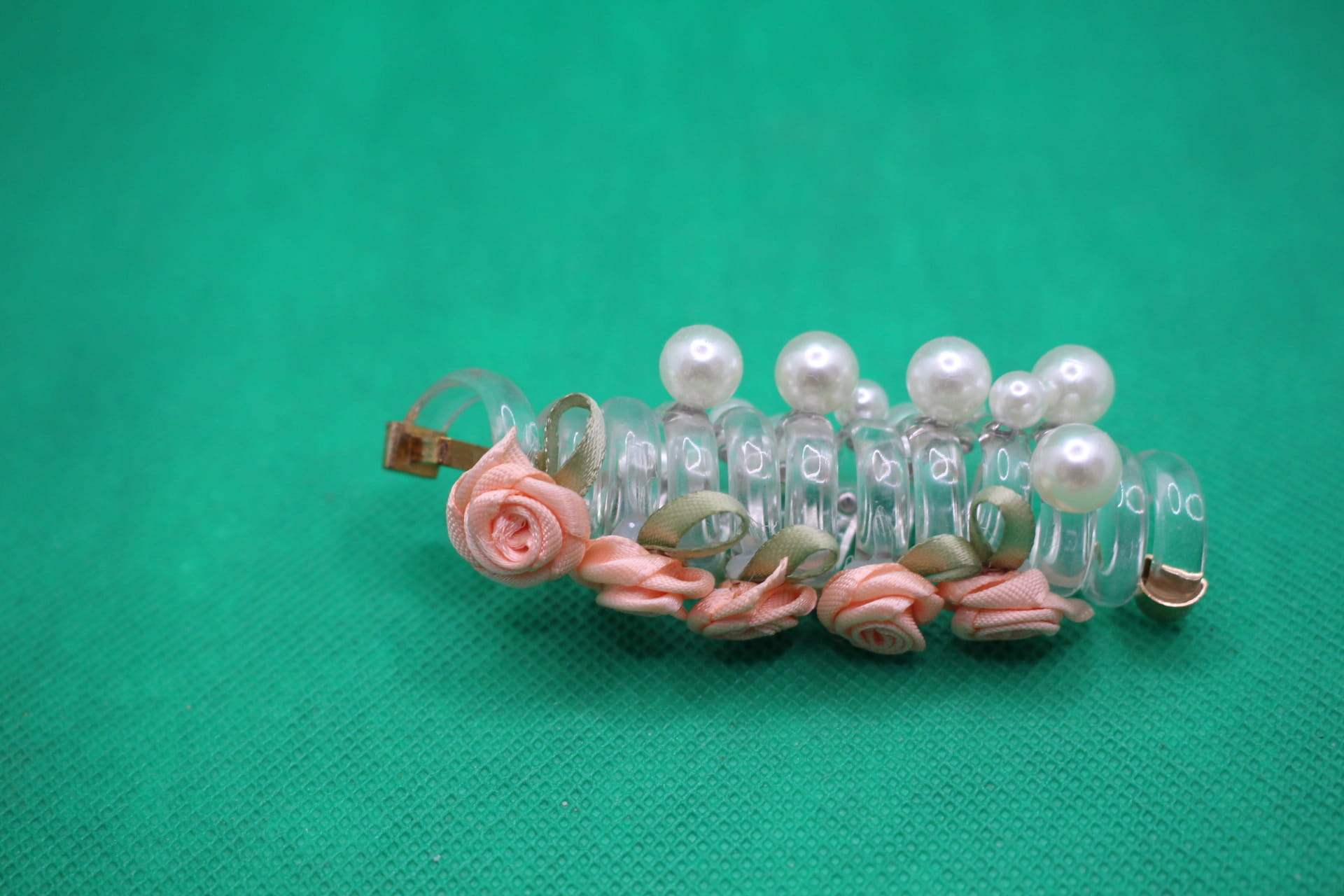 rose telephone cord hair tie side view -- peach color