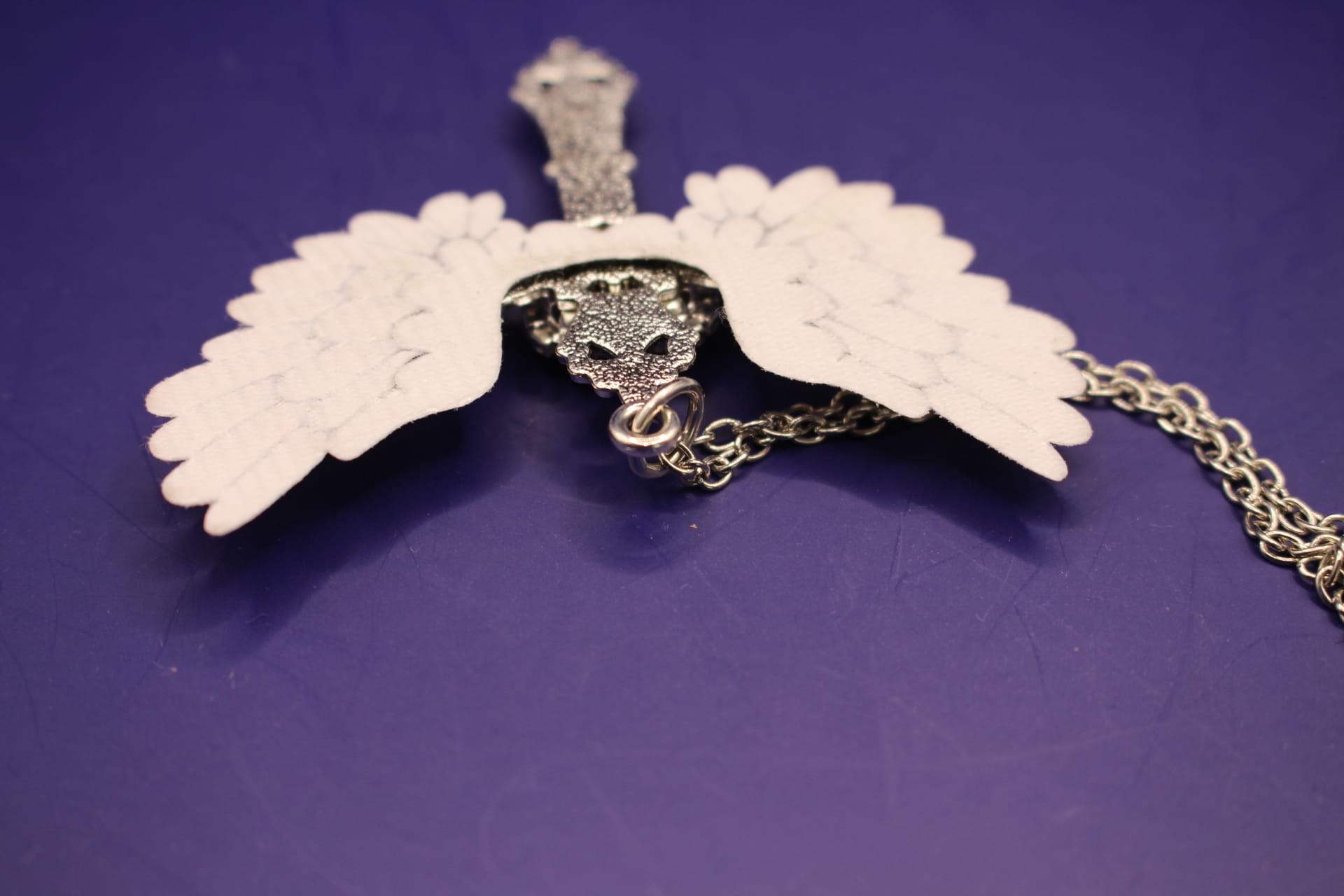large stainless steel cross necklace, back, top view