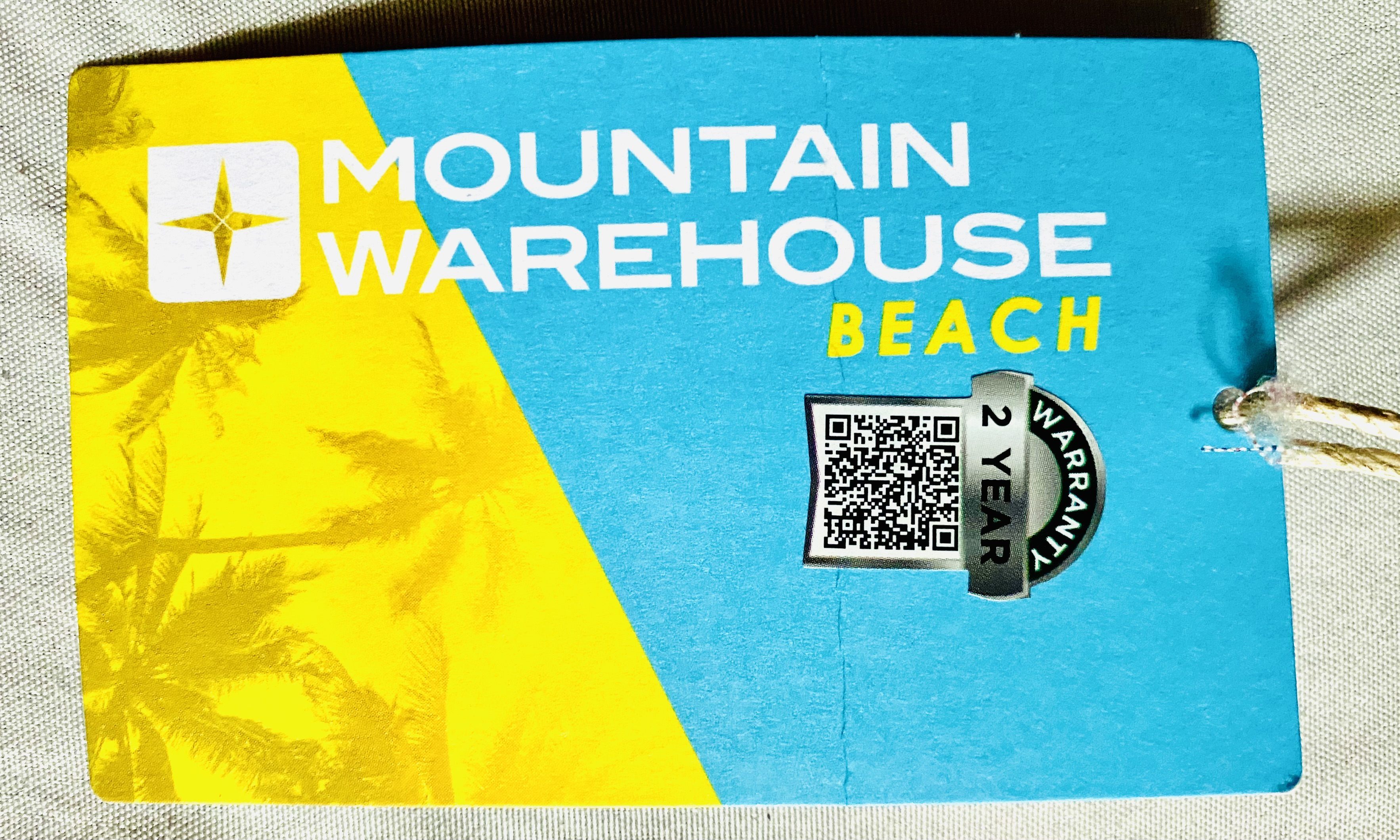 two-year warranty sticker from Mountain Warehouse board shorts we bought