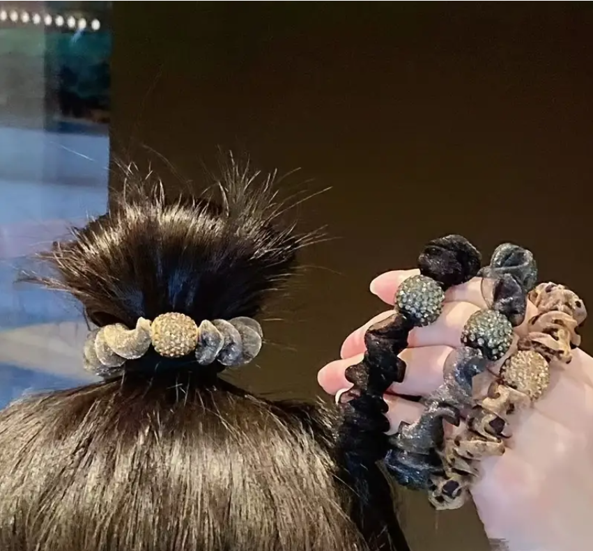 fancy elastic hair ties variations, with one worn on hair, taken from Temu promo page