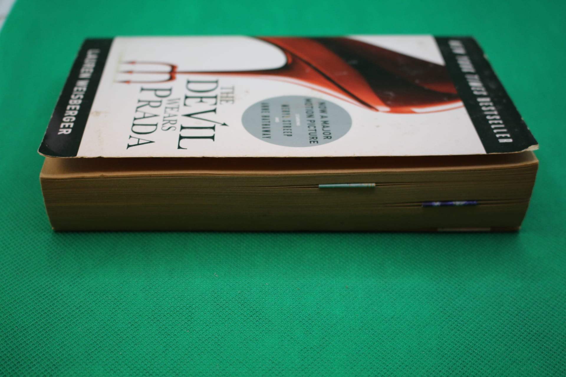 magnetic bookmark in book, shown from side to show thinness and how they can hold multiple pages together
