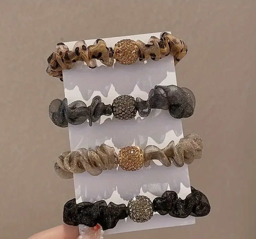 fancy elastic hair ties variations displayed on paper, taken from Temu promo page