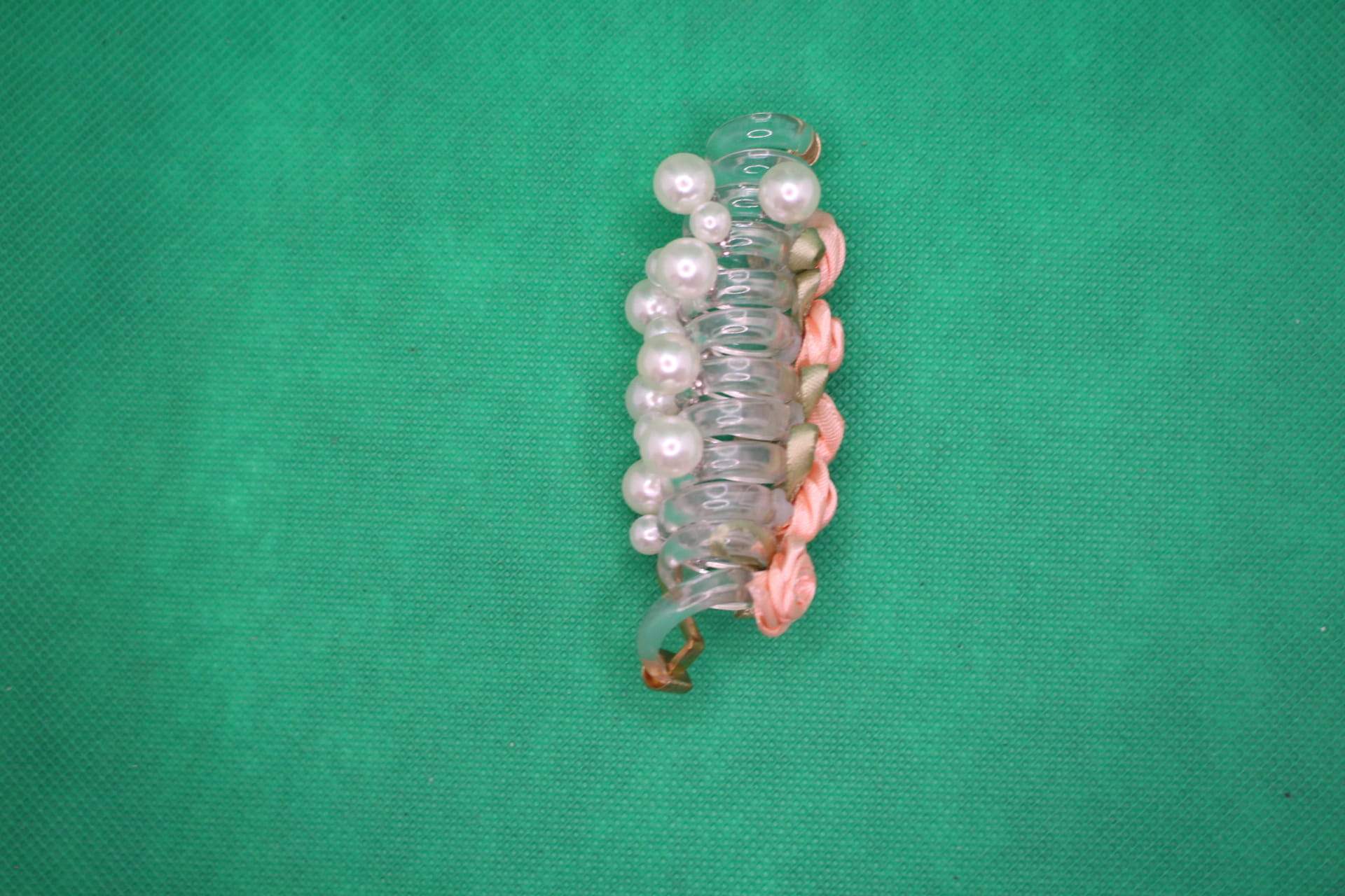 rose telephone cord hair tie side view -- peach color