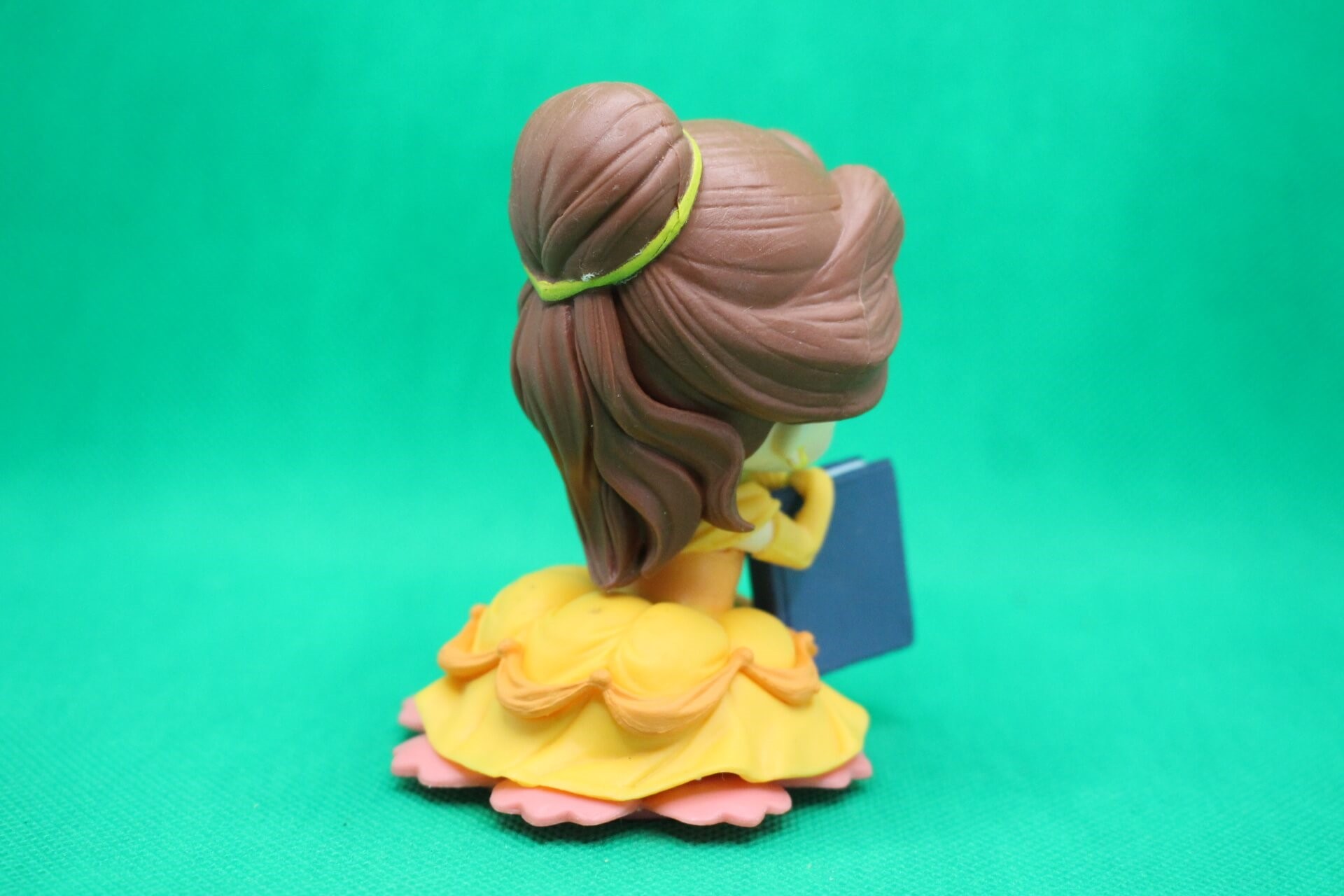 Belle figurine back side view