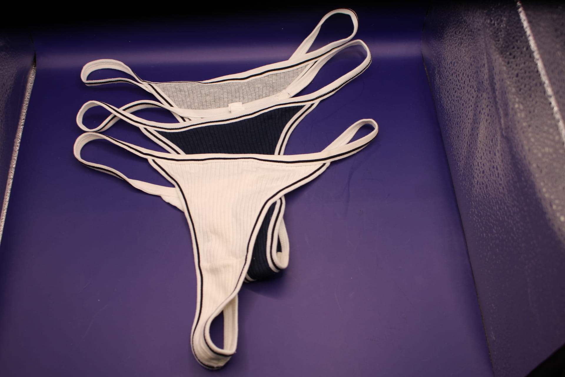 3 v-strings from cotton v string pack -- grey, black, and cream