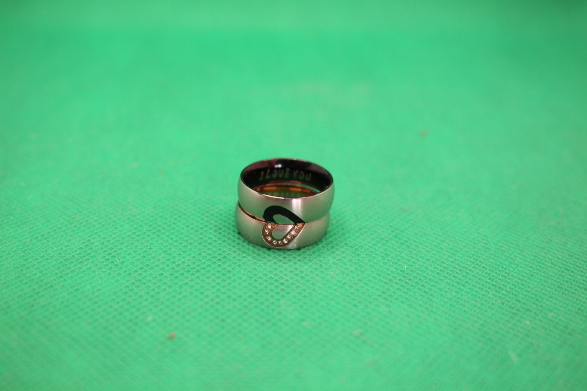 half hearts forming whole hearts together couple rings