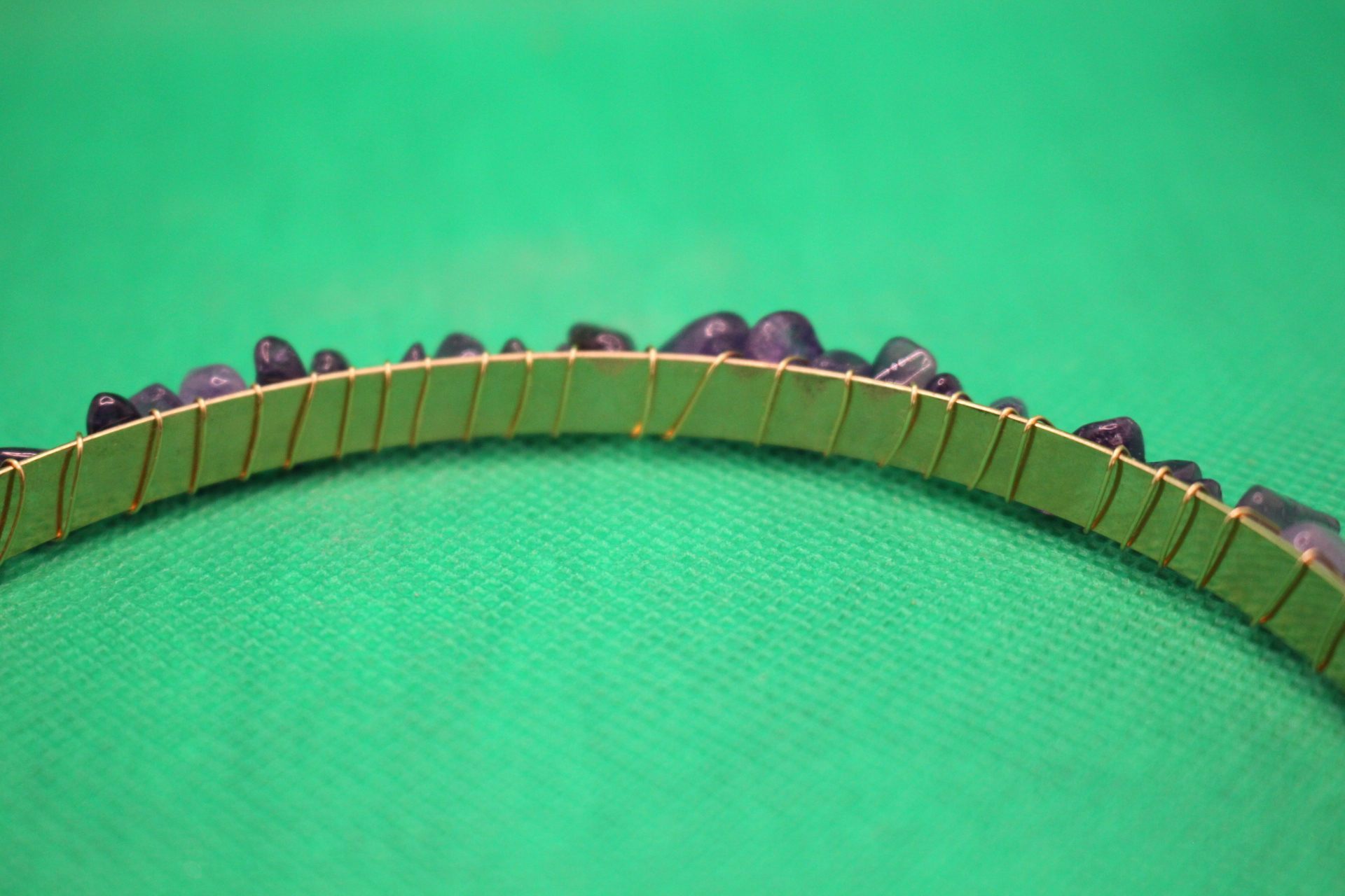 close-up of weaving of crystals into headband
